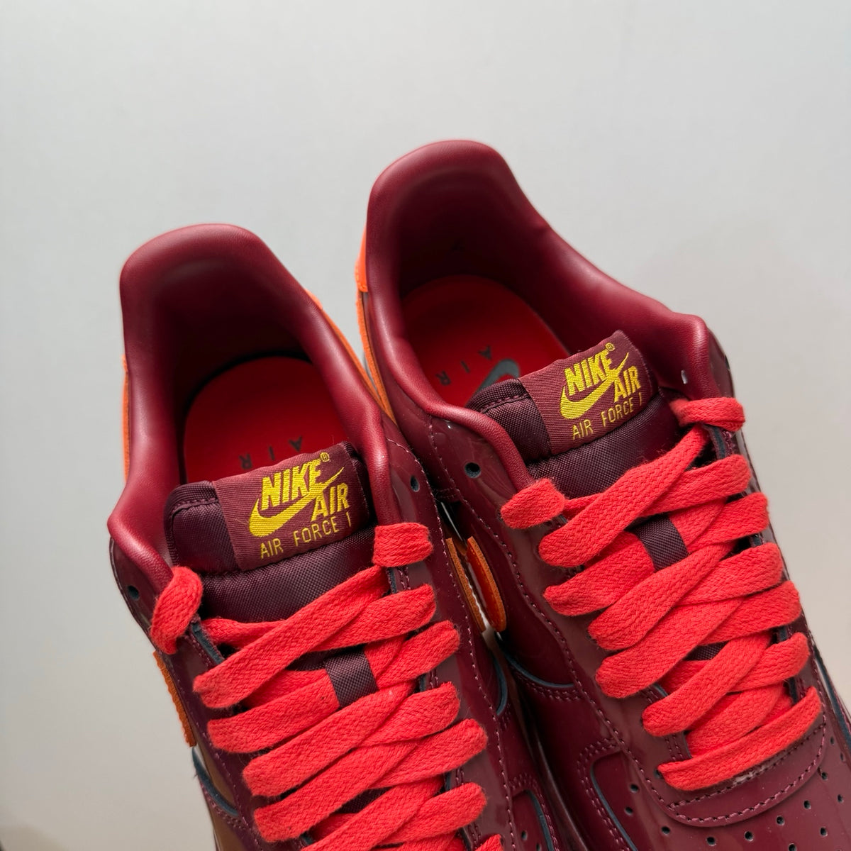 Nike Air Force 1 Patent Pack Men’s Burgundy & Orange Sneakers, Glossy Low-Top Lace-Up Casual Streetwear Shoes
